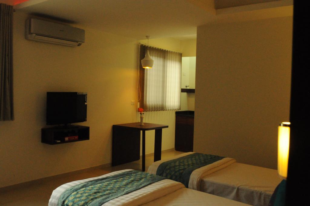 Ixora Suites Bangalore Habitación foto